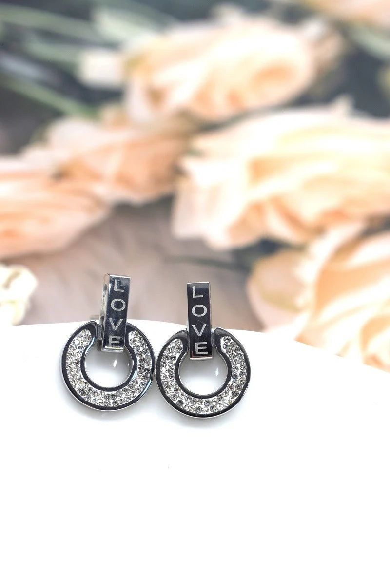 BOUCLE D'OREILLE EN ACIER ET STRASS